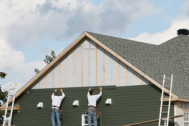 Professional Siding Installation technician working in West Newton, MA